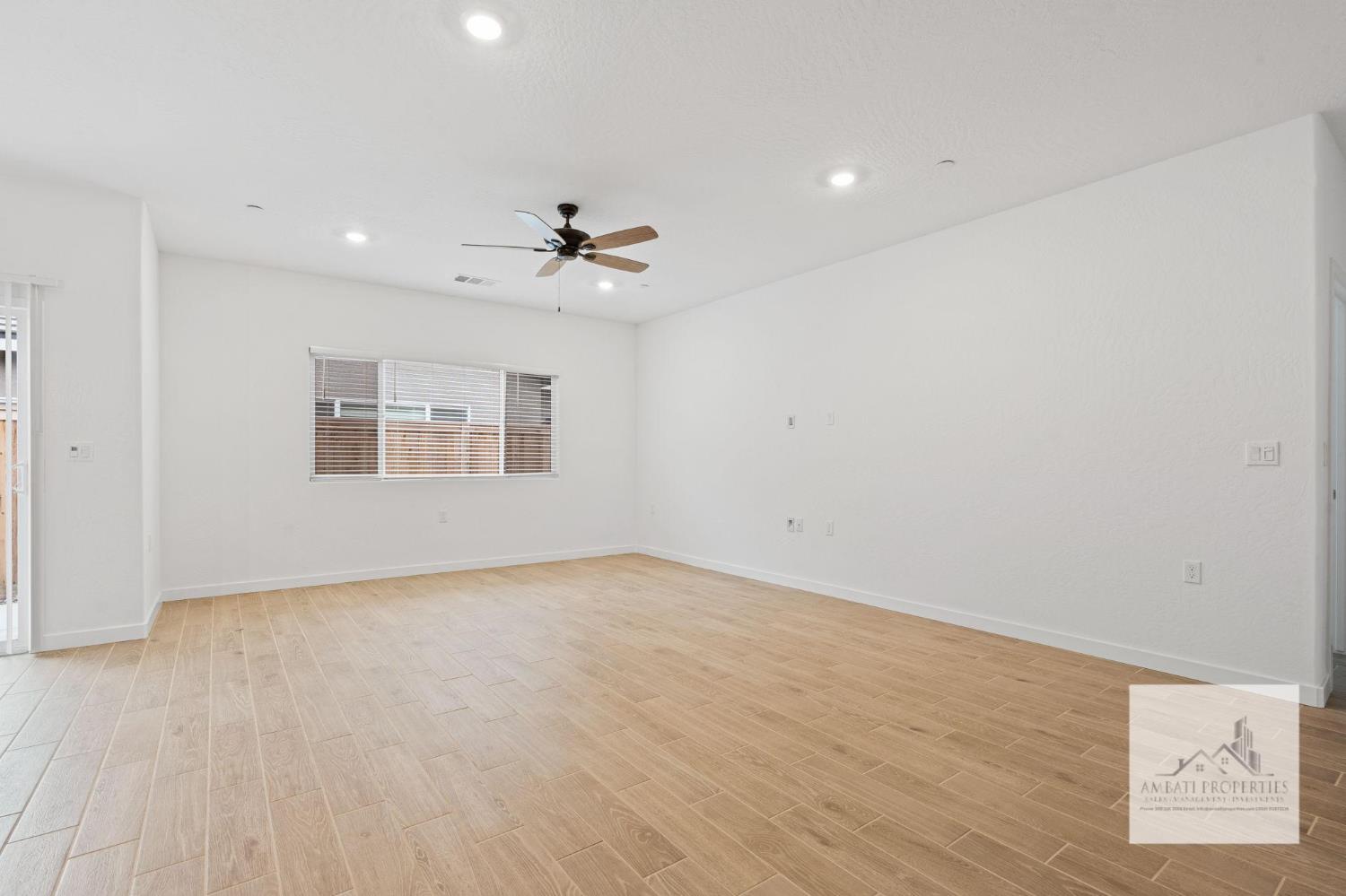 1017 Springtime Avenue Clovis, CA 93619 - Photo 9 of 13 a view of an empty room with windows