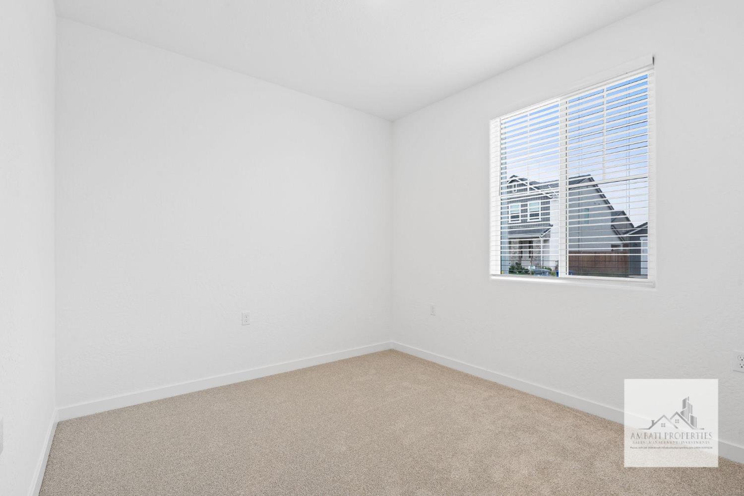 1017 Springtime Avenue Clovis, CA 93619 - Photo 10 of 13 a view of an empty room with a window