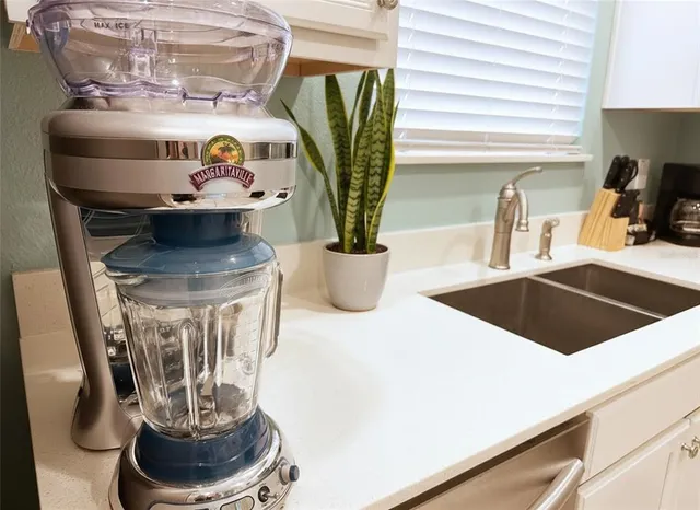 a kitchen with a stove and a sink