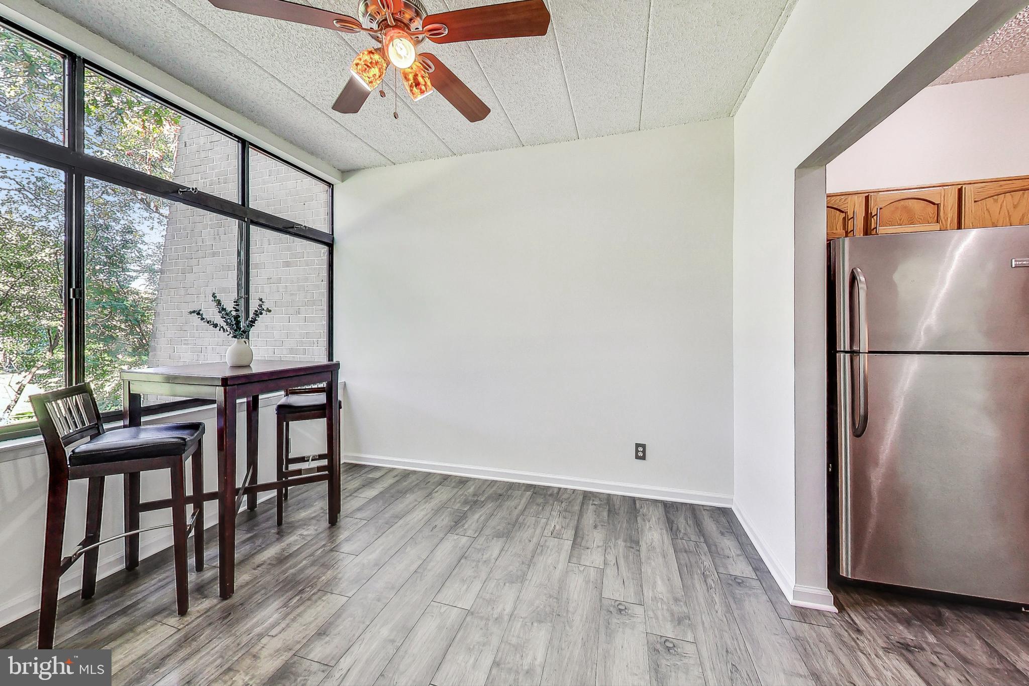 2120 Green Watch Way, Unit 201 Reston, VA 20191 - Photo 7 of 51 Dining Area Off Kitchen with Laminate Flooring