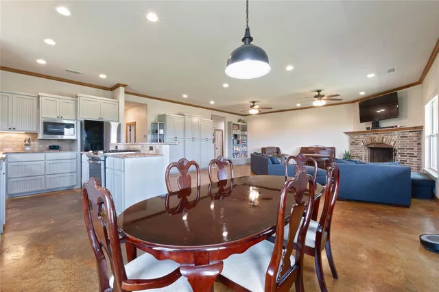 a dining room with furniture a window and kitchen view