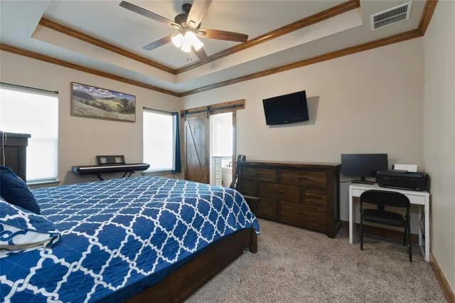 a bedroom with a bed and a desk