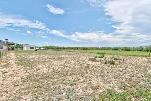 a view of a lake with houses in the back
