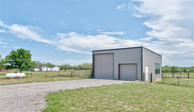 a view of a backyard of the house