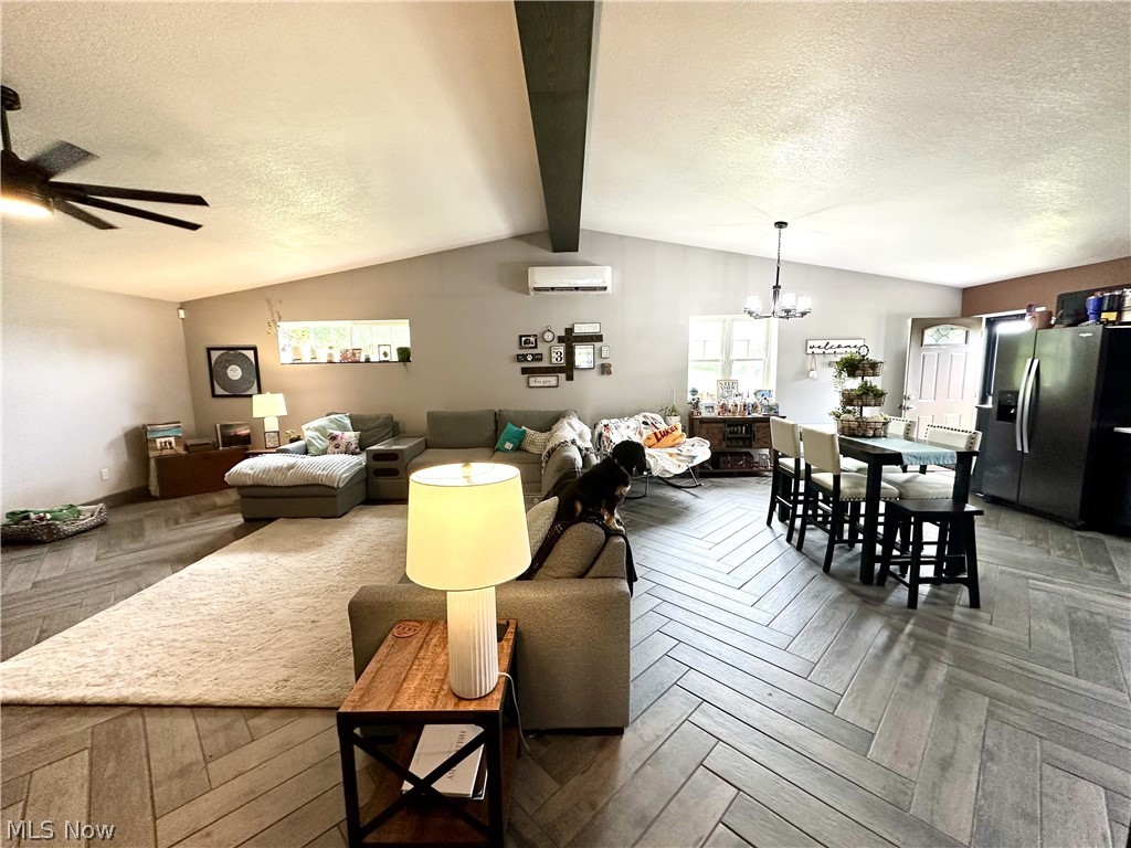 148 Rural Lane Chester, WV 26034 - Photo 3 of 32 Living room featuring ceramic tile flooring, exposed beams, and ceiling fan