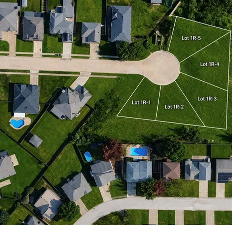 an aerial view of a house roof deck and patio