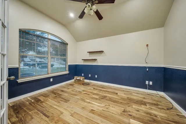 a view of an empty room with a window