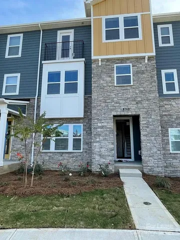 a front view of a house with yard