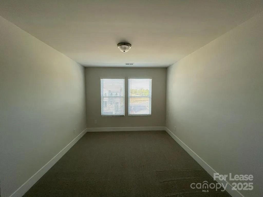 3121 Treble Court Charlotte, NC 28262 - Photo 11 of 14 an empty room with a window
