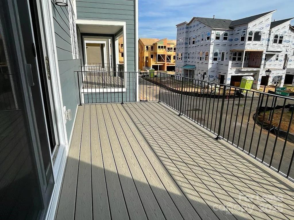 3121 Treble Court Charlotte, NC 28262 - Photo 12 of 14 a view of a balcony with wooden floor