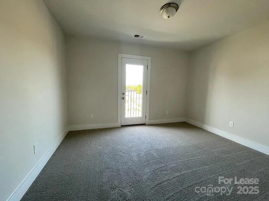 3121 Treble Court Charlotte, NC 28262 - Photo 10 of 14 an empty room with a window