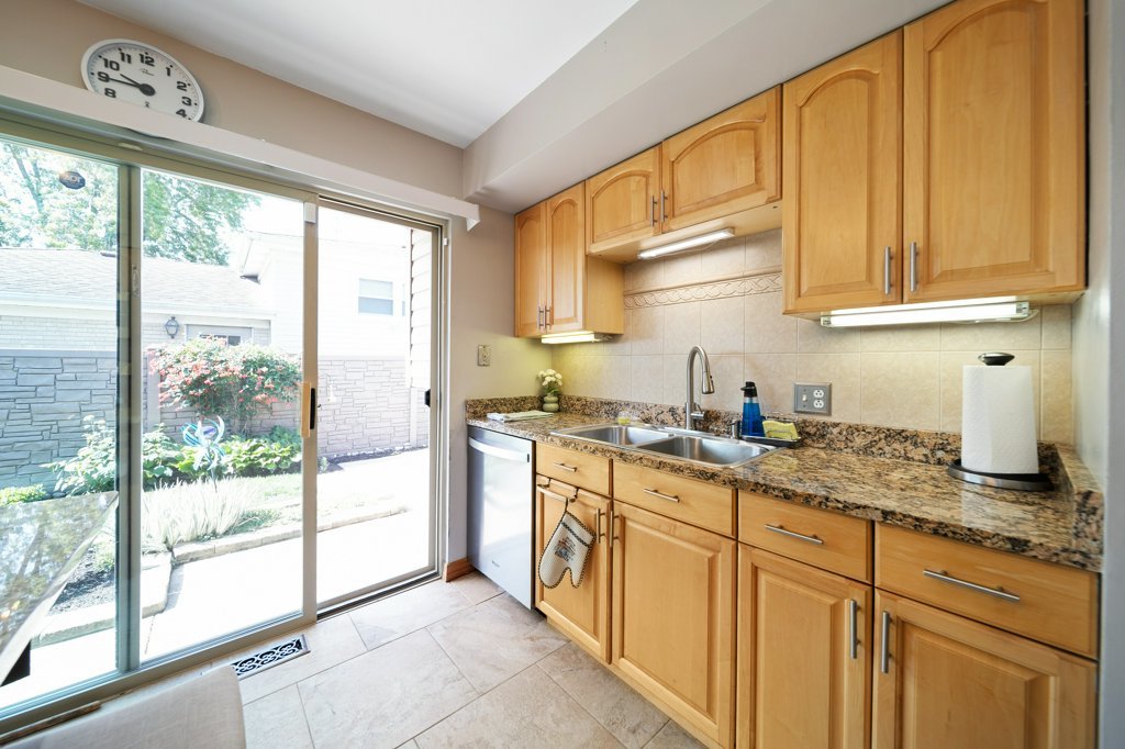 365 West Myrick Avenue Addison, IL 60101 - Photo 8 of 49 a kitchen with granite countertop a sink and a window