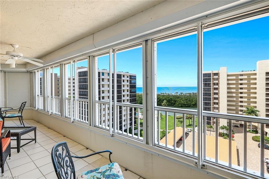 21 Bluebill Avenue, Unit B905 Naples, FL 34108 - Photo 17 of 35 a view of a balcony with chairs