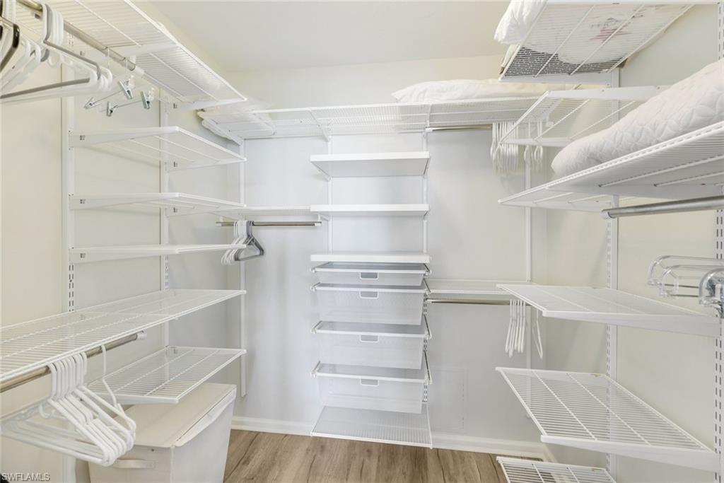 21 Bluebill Avenue, Unit B905 Naples, FL 34108 - Photo 18 of 35 a view of walk in closet with empty racks