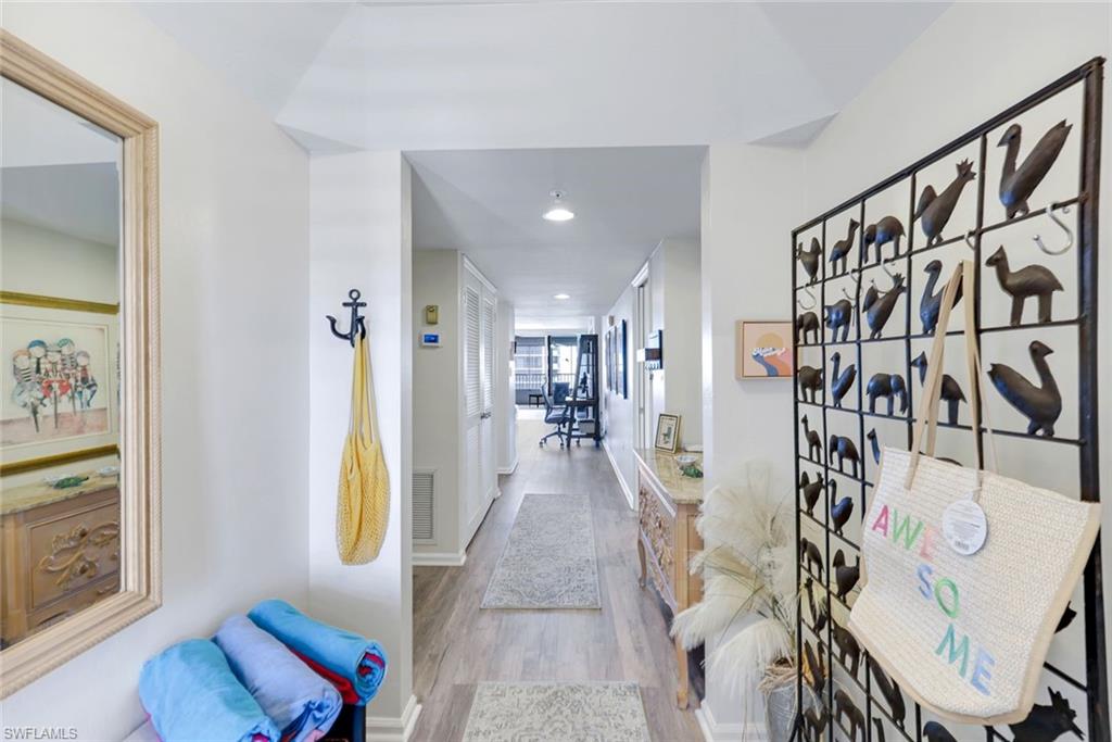 21 Bluebill Avenue, Unit B905 Naples, FL 34108 - Photo 4 of 35 a view of a hallway with interior of the living room