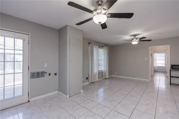 a view of an empty room with a window