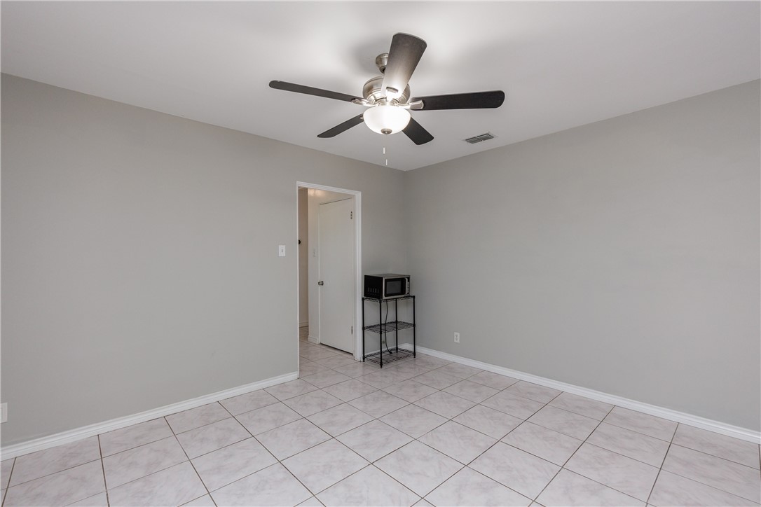 4122 Barnes Street Corpus Christi, TX 78411 - Photo 14 of 39 an empty room with closet and fan