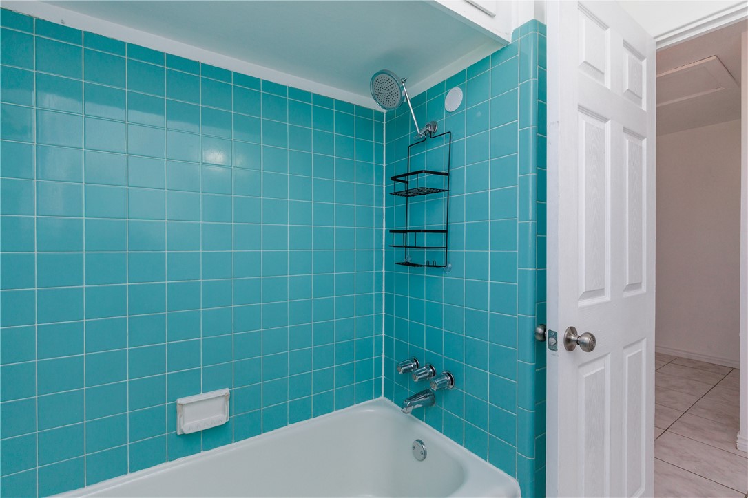 4122 Barnes Street Corpus Christi, TX 78411 - Photo 26 of 39 a bathroom with a shower and a bathtub