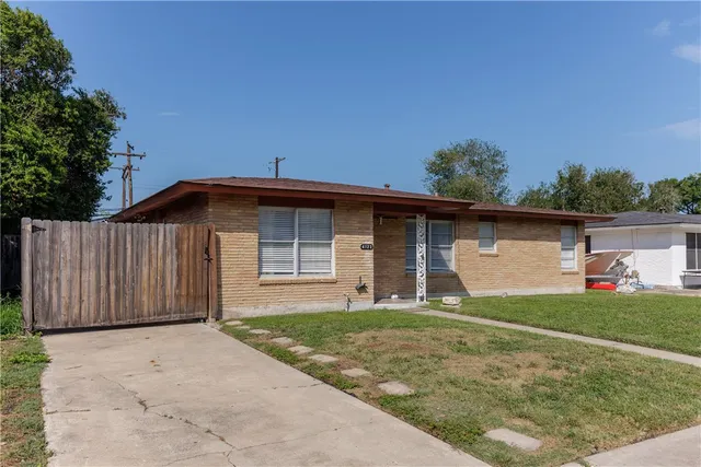 a backyard of a house with yard and garage