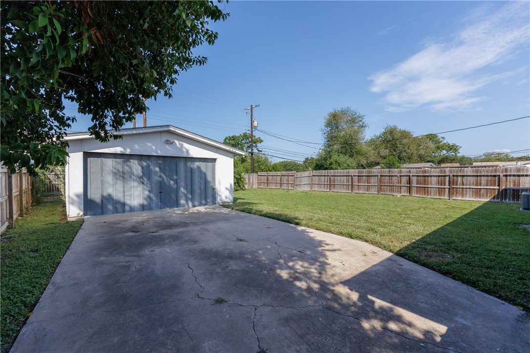 4122 Barnes Street Corpus Christi, TX 78411 - Photo 31 of 39 a view of a back yard of the house and green space