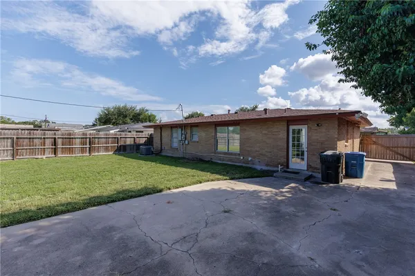 a view of a house with a back yard