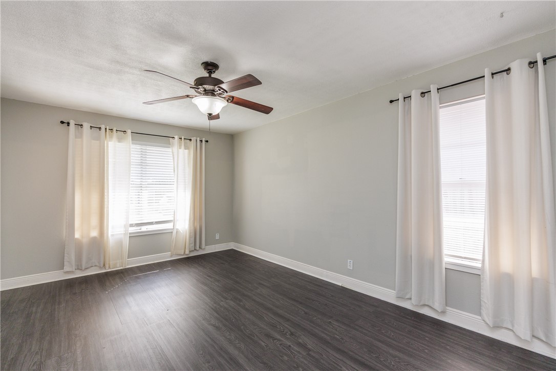 4122 Barnes Street Corpus Christi, TX 78411 - Photo 8 of 39 a view of an empty room with wooden floor and a window