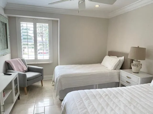 a bedroom with a bed and a couch