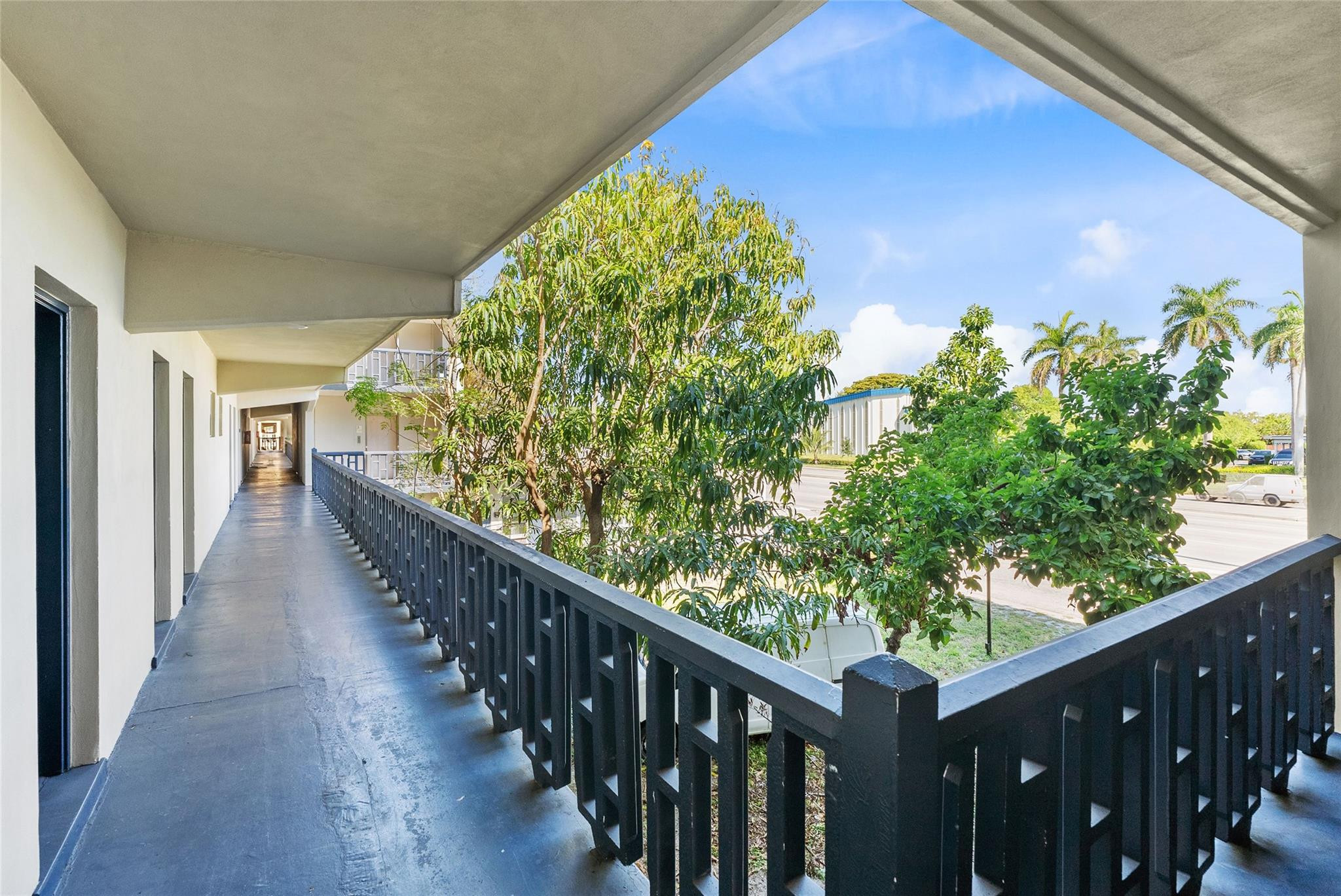 1150 East Sample Road, Unit 202 Pompano Beach, FL 33064 - Photo 19 of 20 a view of a hardwood deck