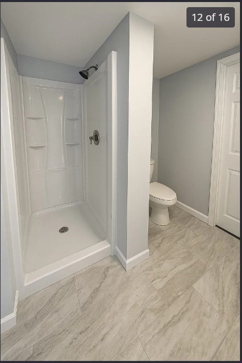 9 Avon Place, Unit 1 Haverhill, MA 01832 - Photo 12 of 16 a bathroom with a shower and a toilet