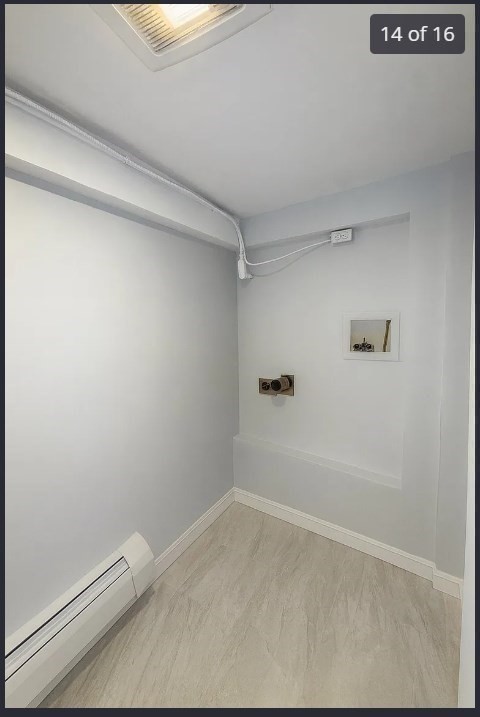 9 Avon Place, Unit 1 Haverhill, MA 01832 - Photo 14 of 16 a view of a room with racks on the wall