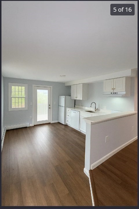 9 Avon Place, Unit 1 Haverhill, MA 01832 - Photo 5 of 16 a view of kitchen and hall with wooden floor