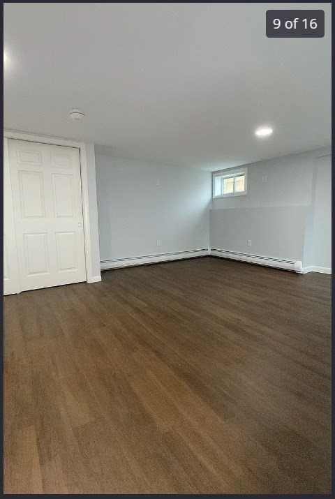 9 Avon Place, Unit 1 Haverhill, MA 01832 - Photo 9 of 16 an empty room with wooden floor and windows