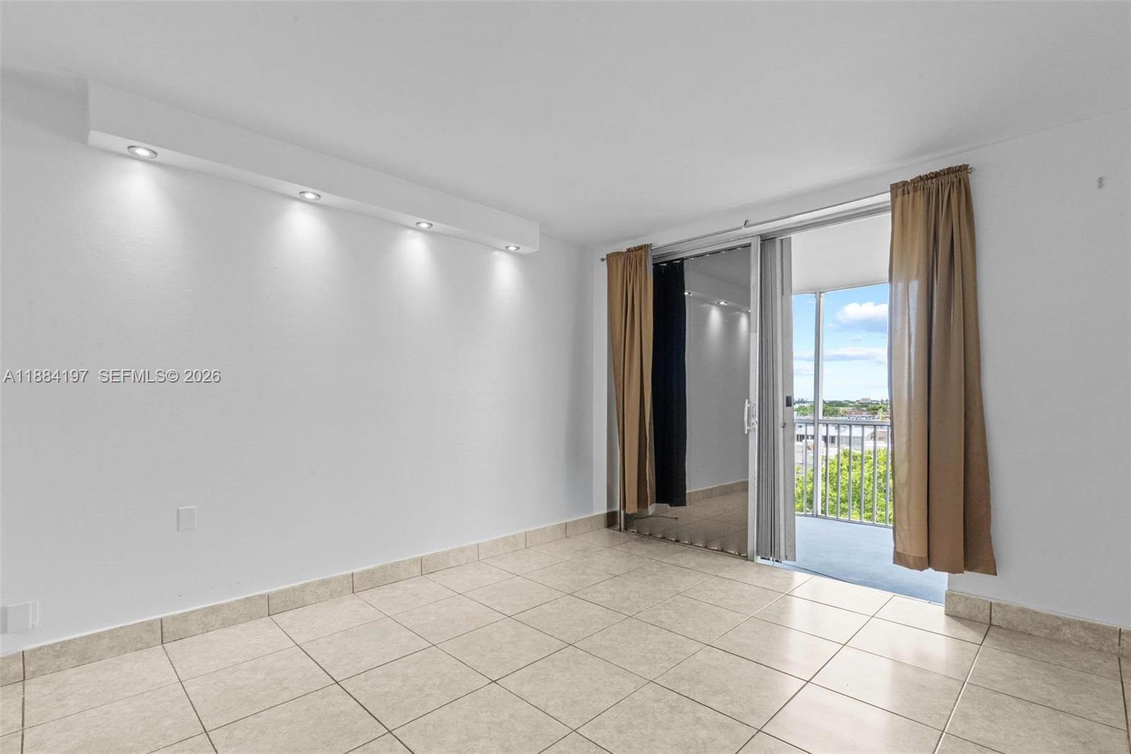 1750 Northeast 191st Street, Unit 7001 Miami, FL 33179 - Photo 15 of 30 a view of an empty room and window