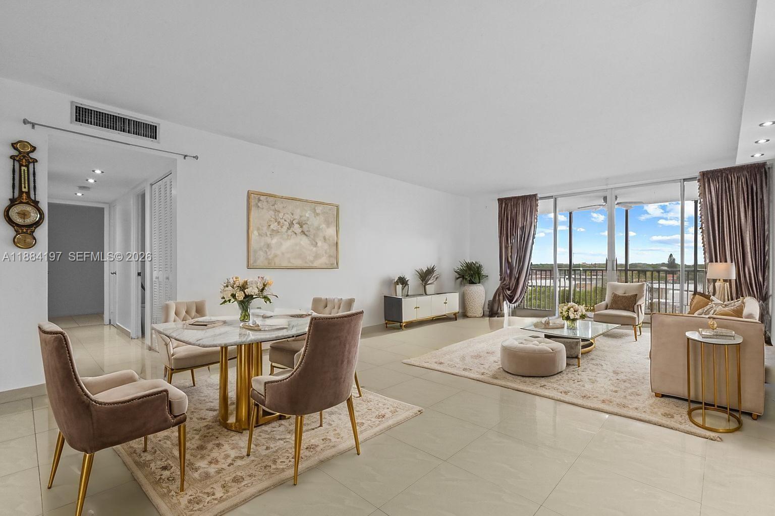 1750 Northeast 191st Street, Unit 7001 Miami, FL 33179 - Photo 3 of 30 a living room with furniture and a large window