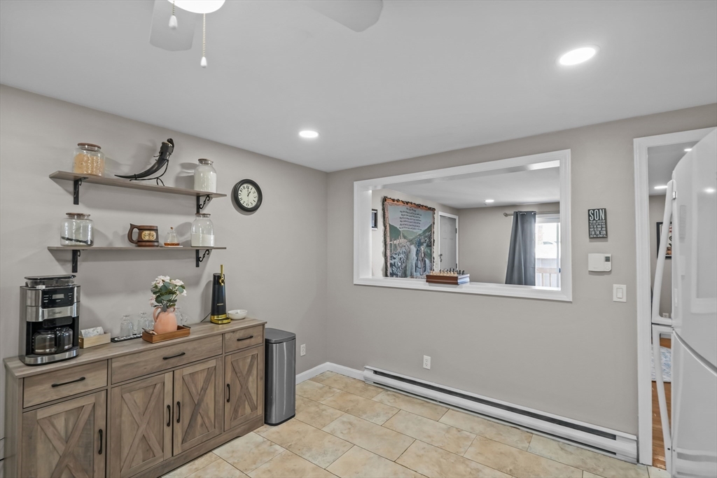 172 Perry Avenue, Unit 1A Worcester, MA 01610 - Photo 19 of 26 a kitchen with cabinets and window