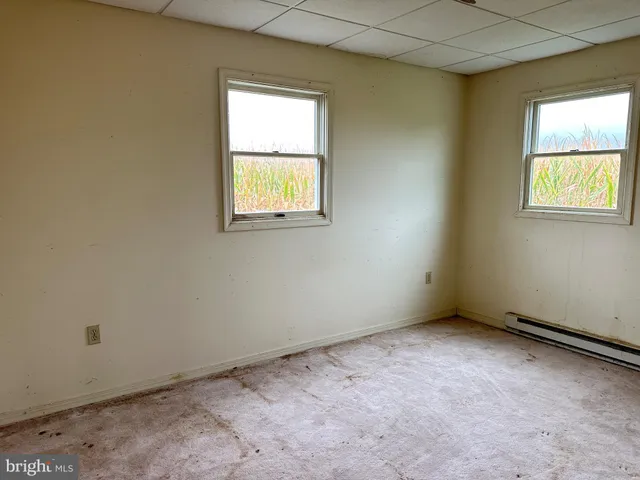 an empty room with windows