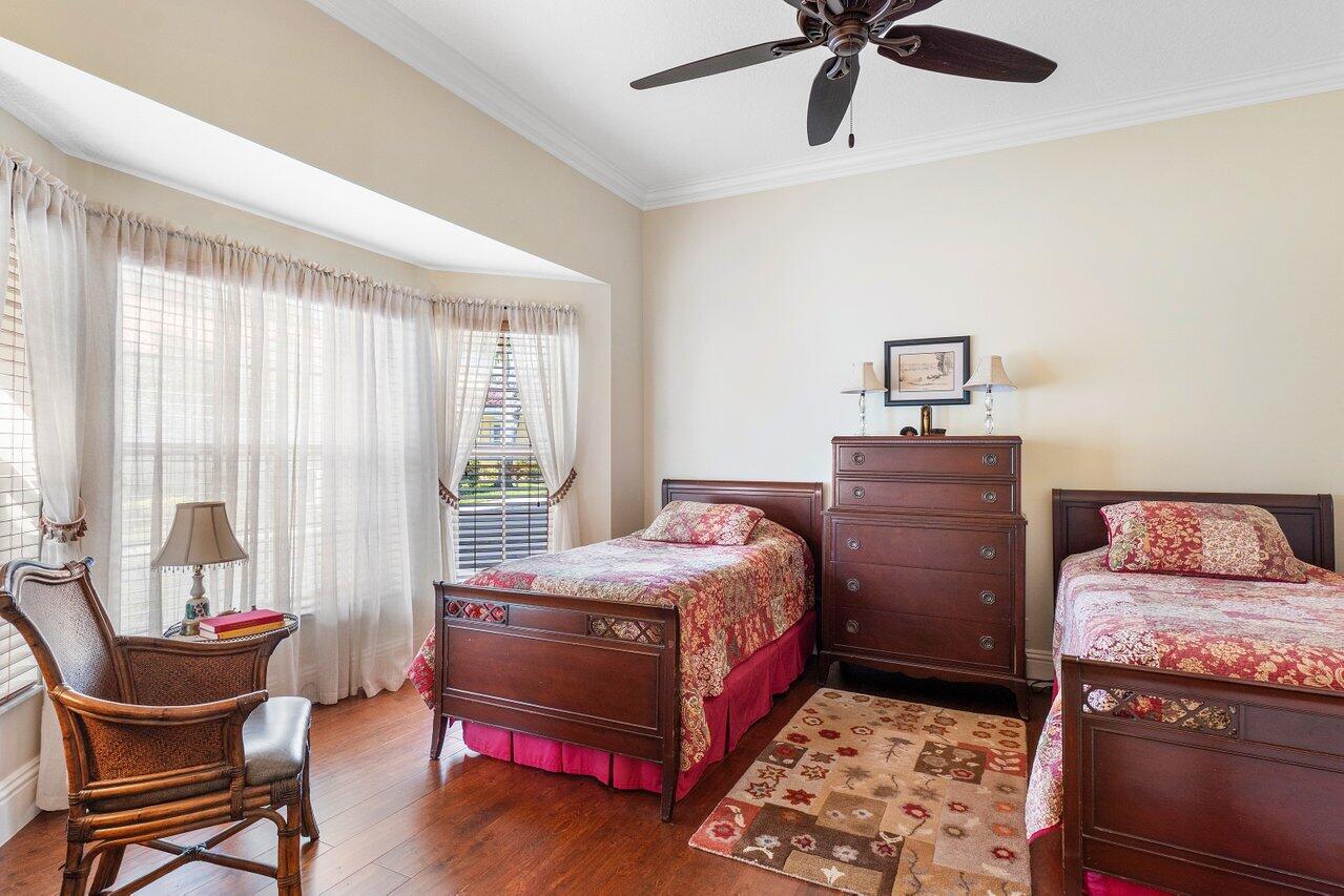 142 Mangrove Bay Way Jupiter, FL 33477 - Photo 13 of 17 a bedroom with a bed and a window