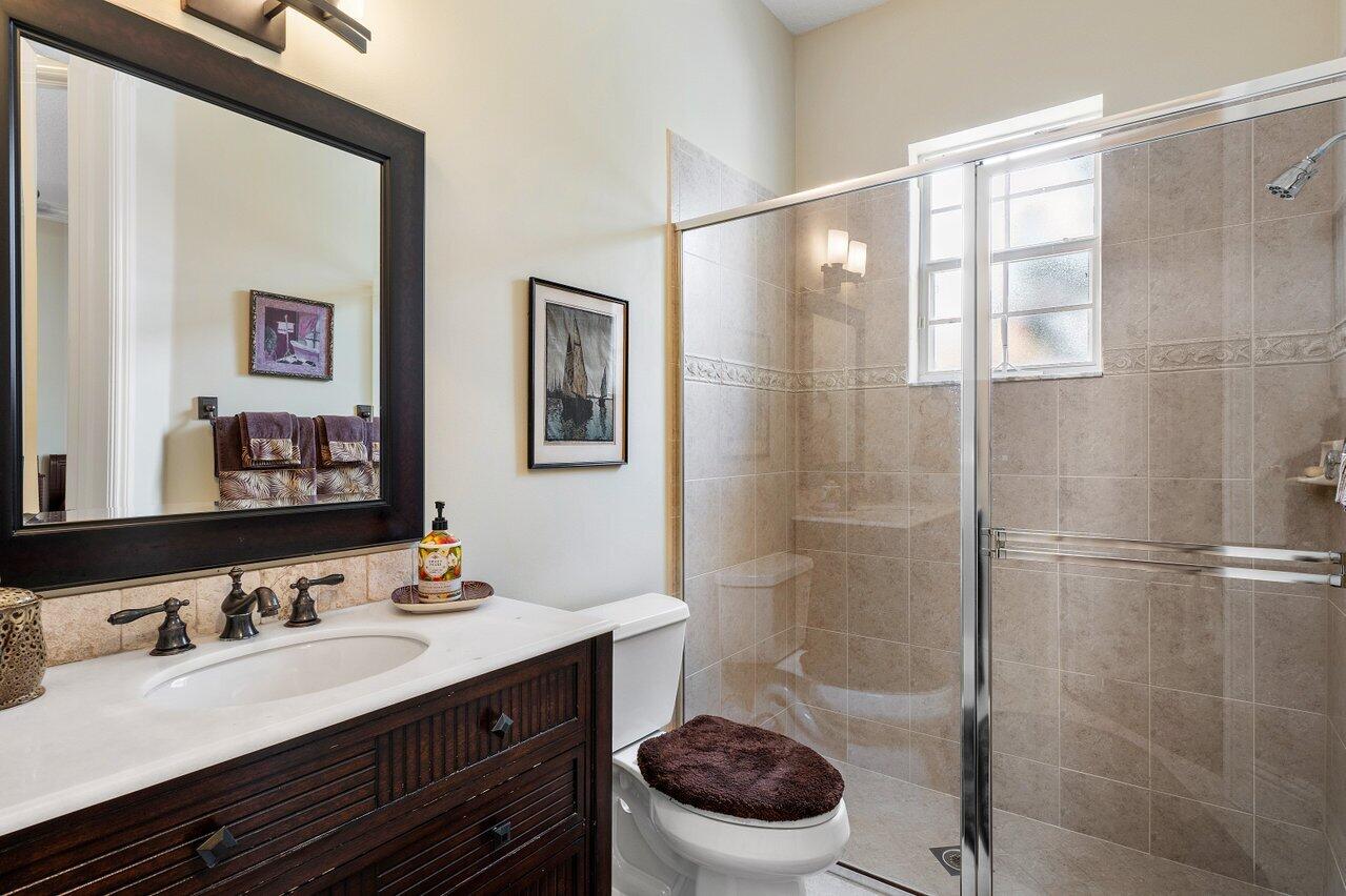 142 Mangrove Bay Way Jupiter, FL 33477 - Photo 14 of 17 a bathroom with a sink a toilet and shower