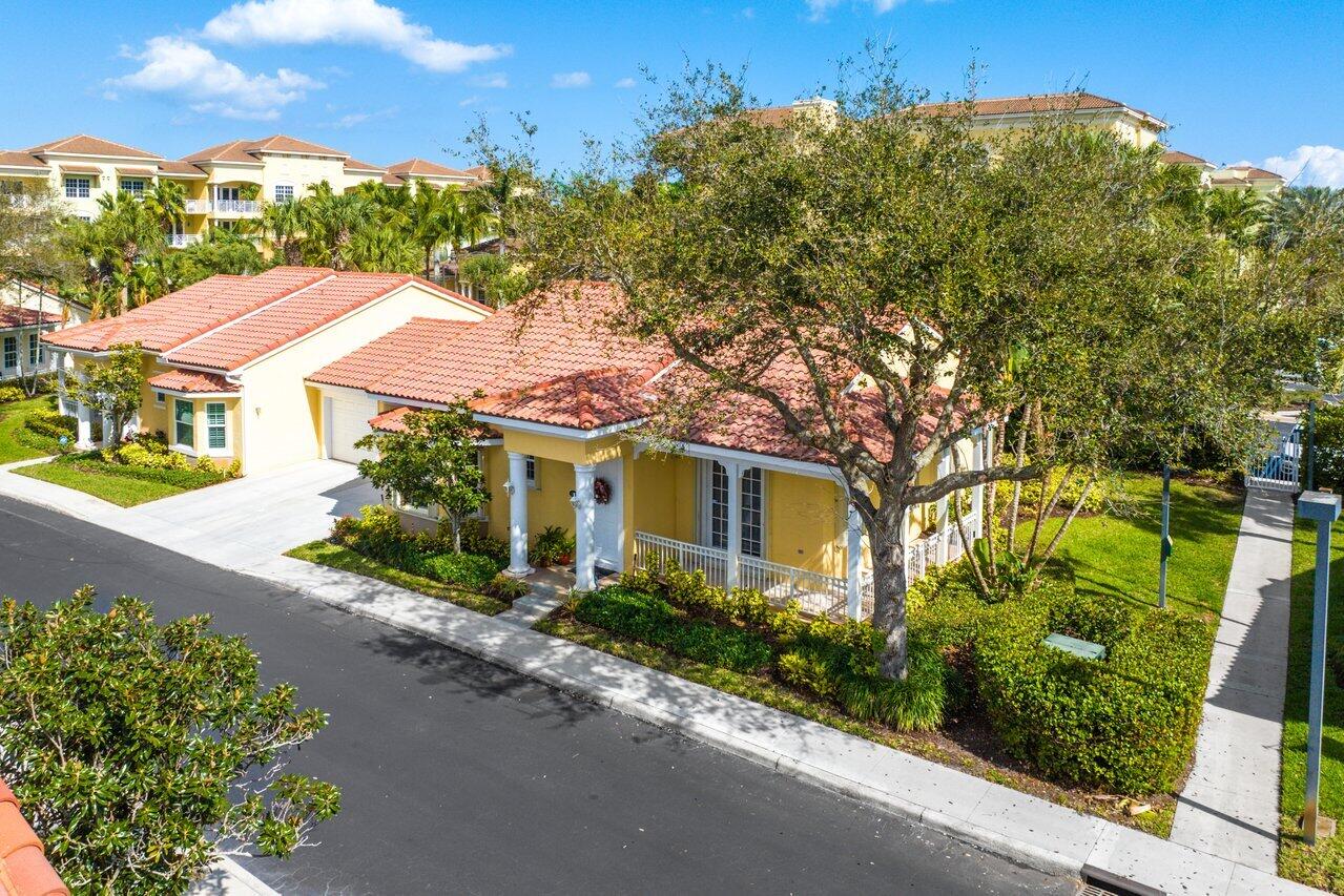 142 Mangrove Bay Way Jupiter, FL 33477 - Photo 15 of 17 a front view of a house with a yard