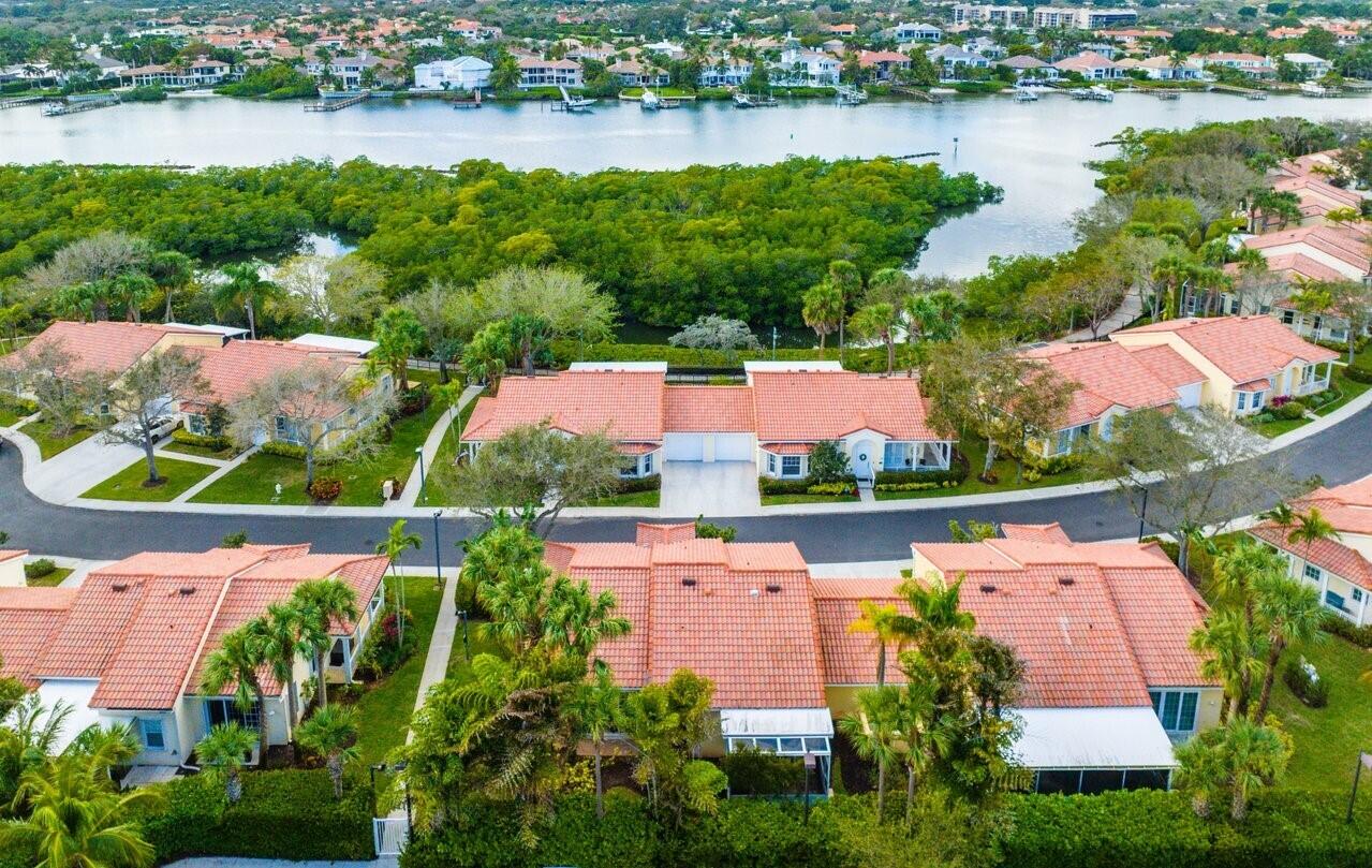 142 Mangrove Bay Way Jupiter, FL 33477 - Photo 16 of 17 an aerial view of lake residential houses with outdoor space and lake view