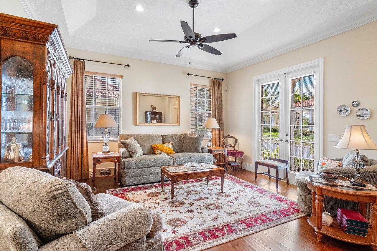 142 Mangrove Bay Way Jupiter, FL 33477 - Photo 3 of 17 a living room with furniture and a large window