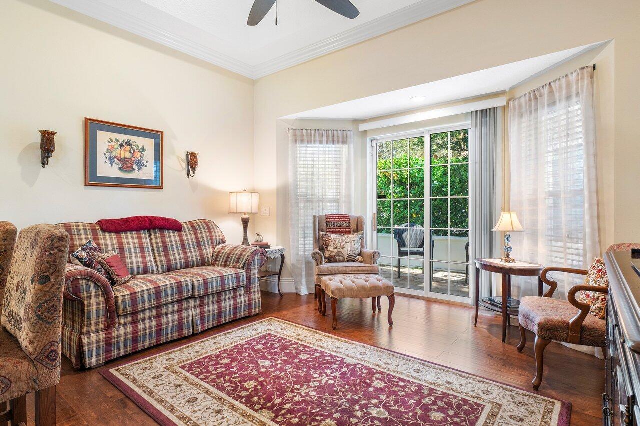 142 Mangrove Bay Way Jupiter, FL 33477 - Photo 8 of 17 a living room with furniture and a rug