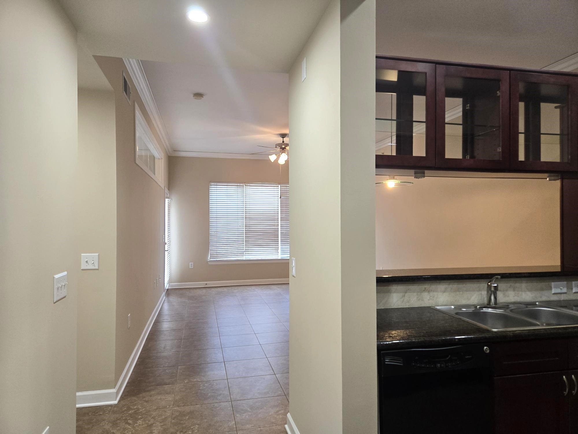 1900 Genesee Street, Unit 207 Houston, TX 77006 - Photo 3 of 50 Great perspective from foyer to kitchen and living room. Notice the beautiful tile floors! ALL tile floors in this condo for easy maintenance.