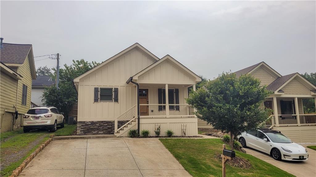 110 Strippling Street Ball Ground, GA 30107 - Photo 1 of 13 a front view of a house with a garden