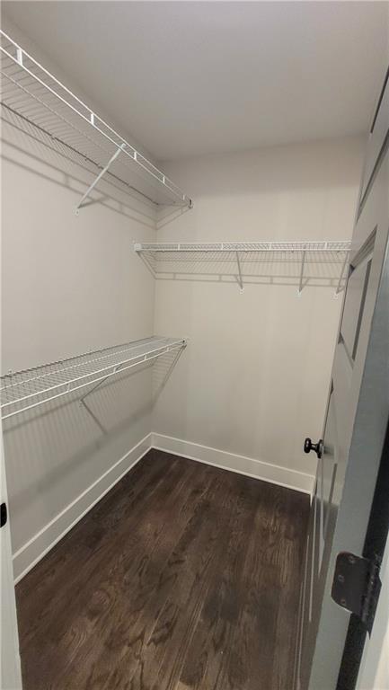 110 Strippling Street Ball Ground, GA 30107 - Photo 11 of 13 a view of a room with racks on the wall