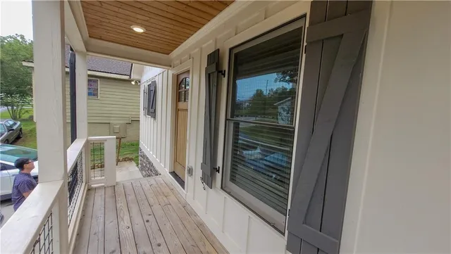 a view of a balcony with wooden floor