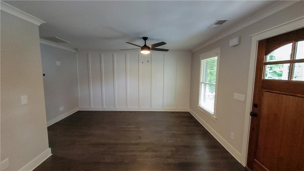 110 Strippling Street Ball Ground, GA 30107 - Photo 6 of 13 wooden floor in an empty room with a window