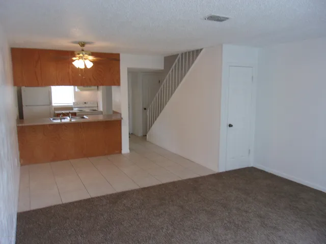 a view of a kitchen with a sink