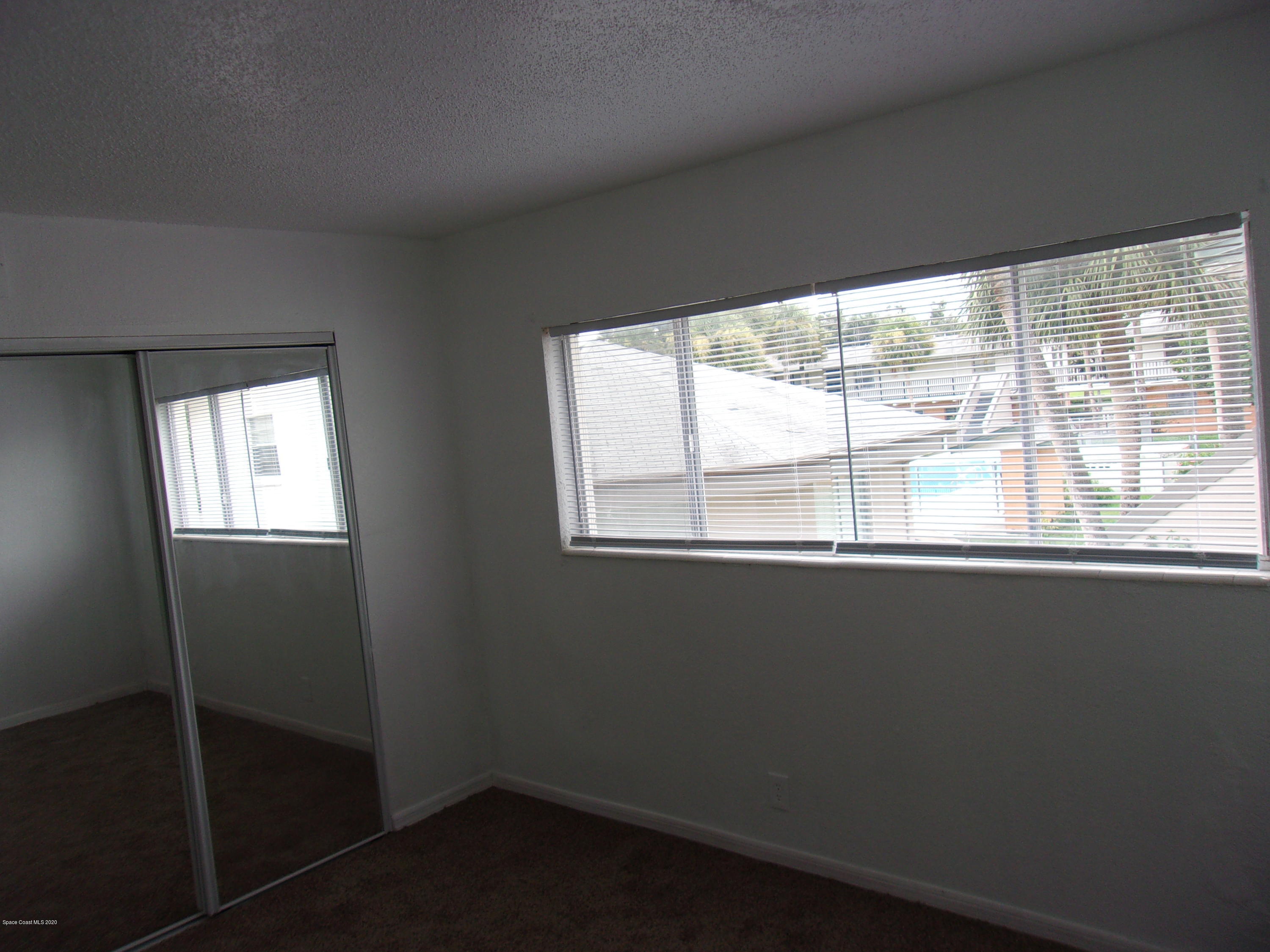 1711 Dixon Boulevard, Unit 242 Cocoa, FL 32922 - Photo 19 of 26 a view of an empty room with a window