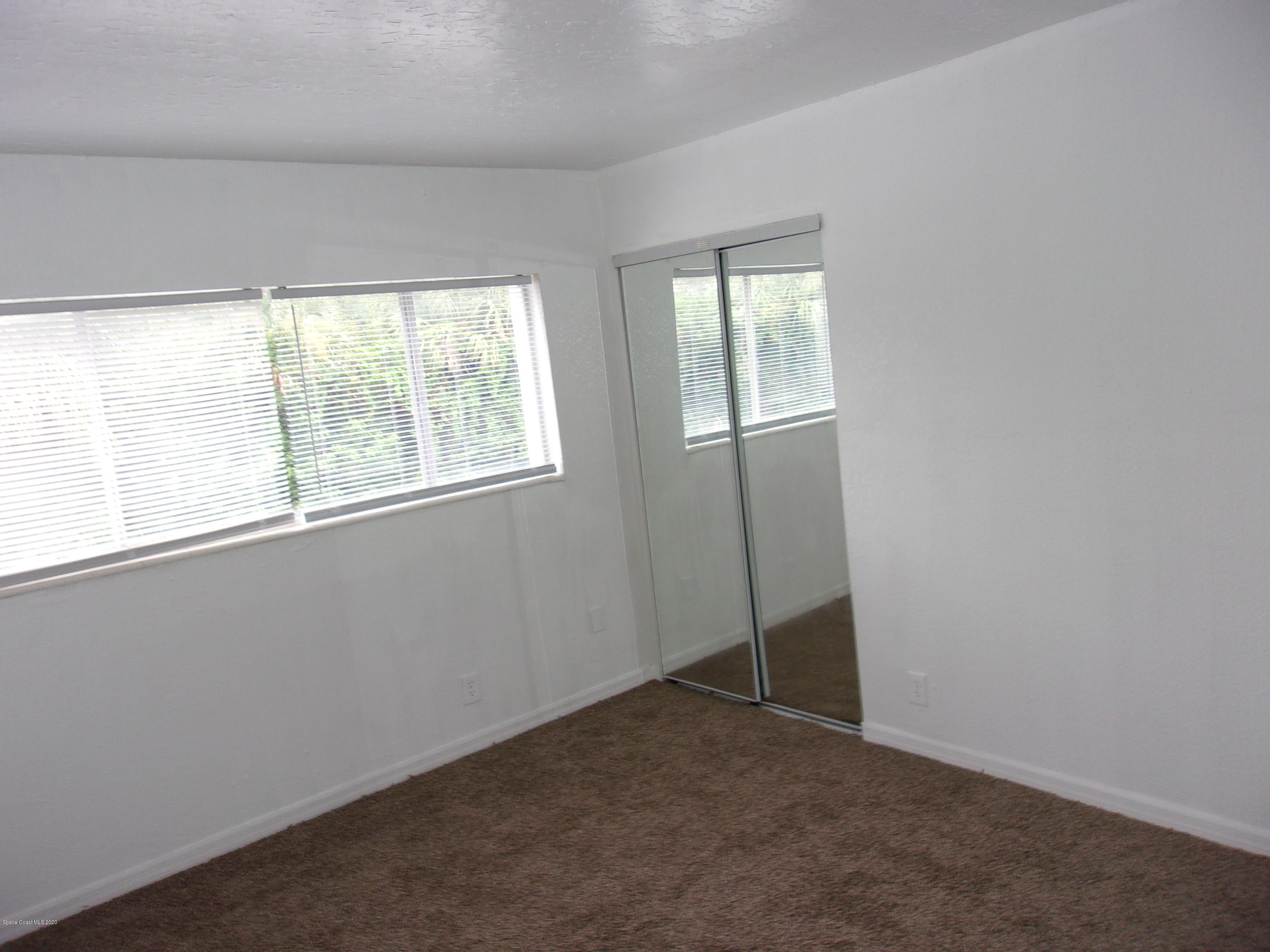 1711 Dixon Boulevard, Unit 242 Cocoa, FL 32922 - Photo 24 of 26 an empty room with a window